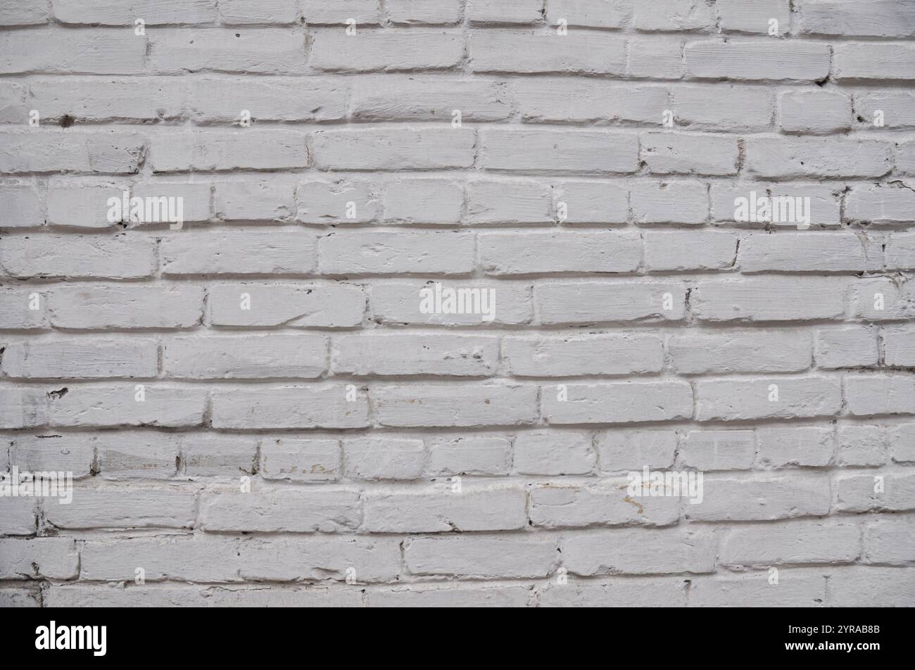 Old brick wall painted white textured backgound Stock Photo