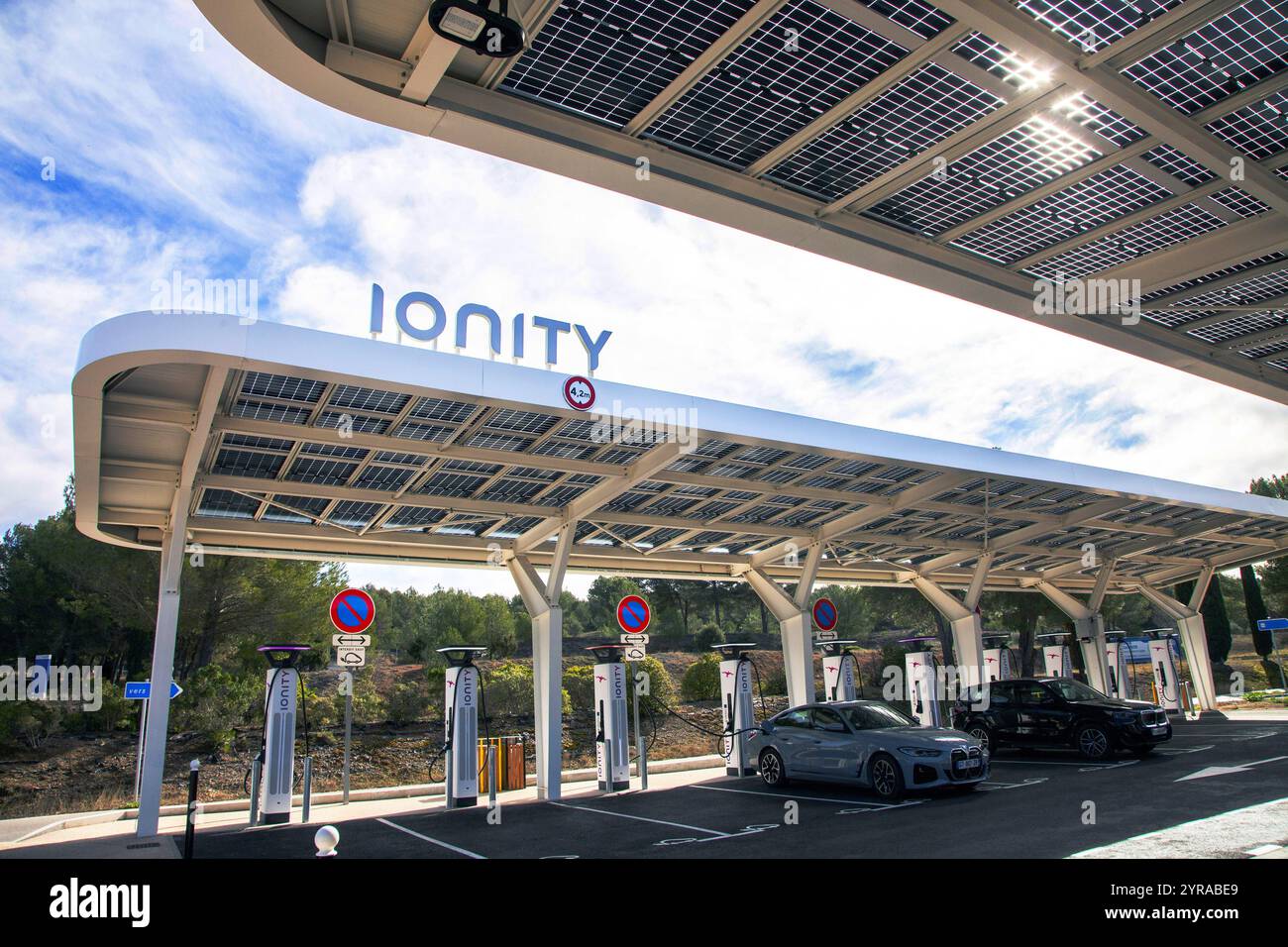 Venelles, A5 freeway (south-eastern France), 2024/02/23: IONITY high-power electrical charging station under canopies, a car park covered by photovolt Stock Photo