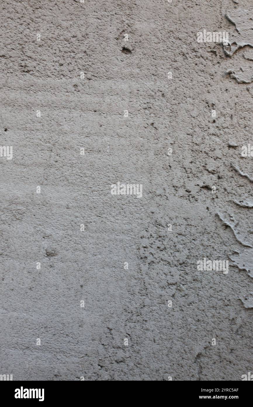 Gray freshly cemented wall close-up. Plaster coating. Stock Photo
