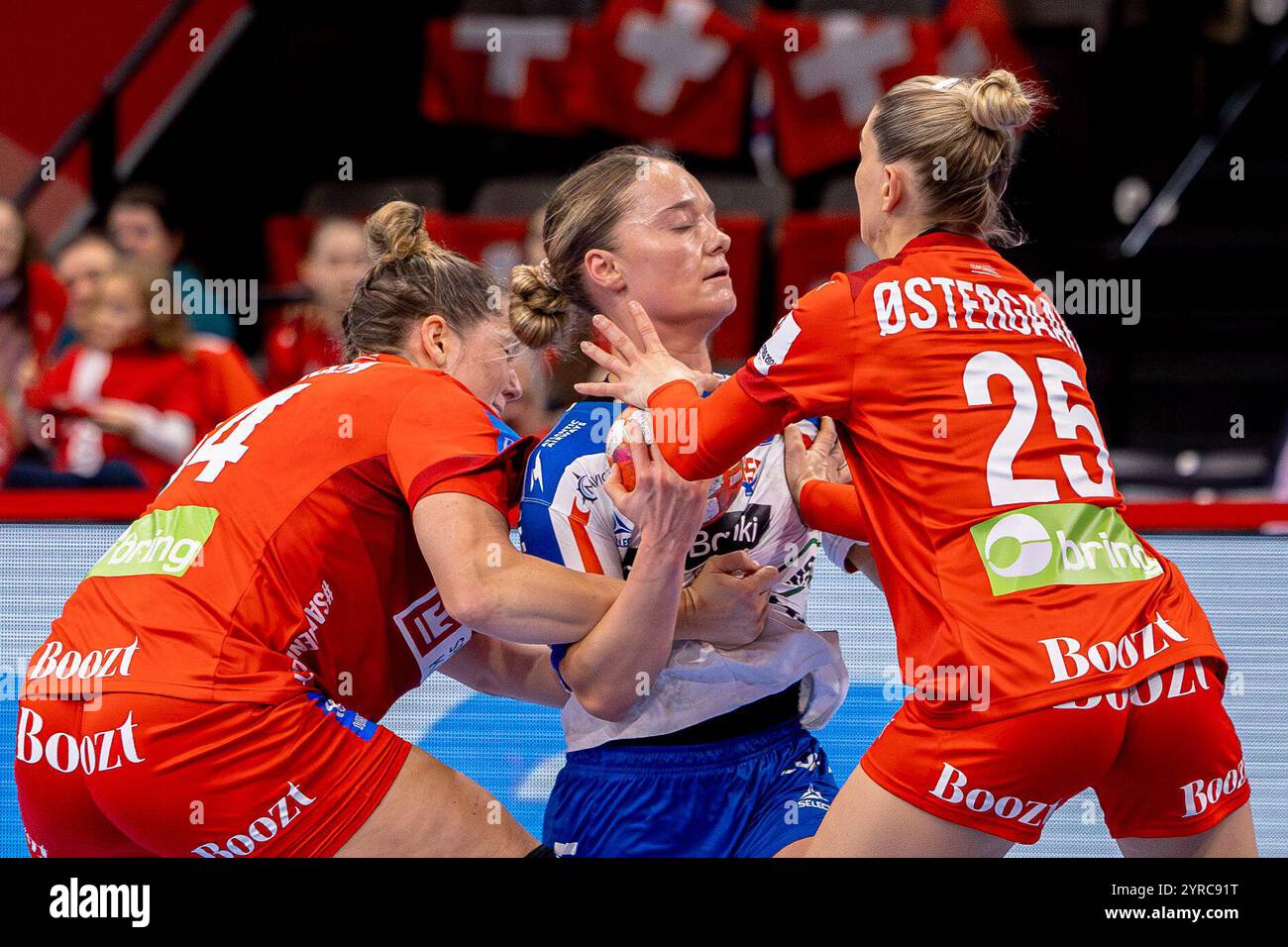 Basel, Switzerland. 03rd Dec, 2024. Basel, Switzerland, December 03st 2024: A duel between Jana Mittún (77 FRO) and Trine Østergaard Jensen (25 DEN) during the Women's EHF Euro 2024 match between Faroe and Denmark at St. Jakobshalle in Basel, Switzerland. Philipp Kresnik (Philipp Kresnik/SPP) Credit: SPP Sport Press Photo. /Alamy Live News Stock Photo