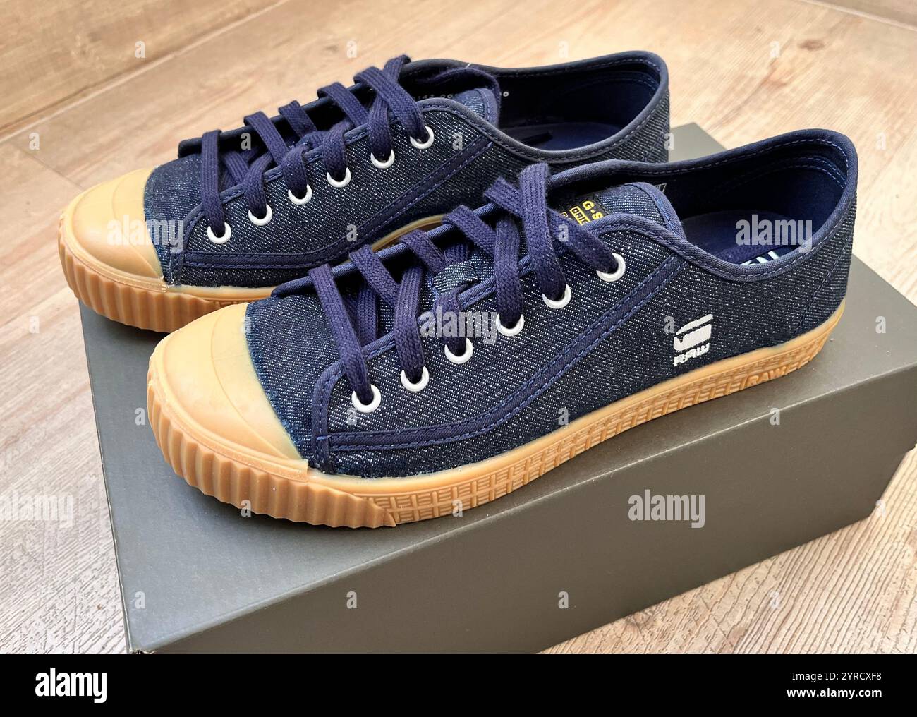 Pair of G-Star Raw men's Rovulc Roel low sneakers dark navy denim - Smartphone Captured Stock Image