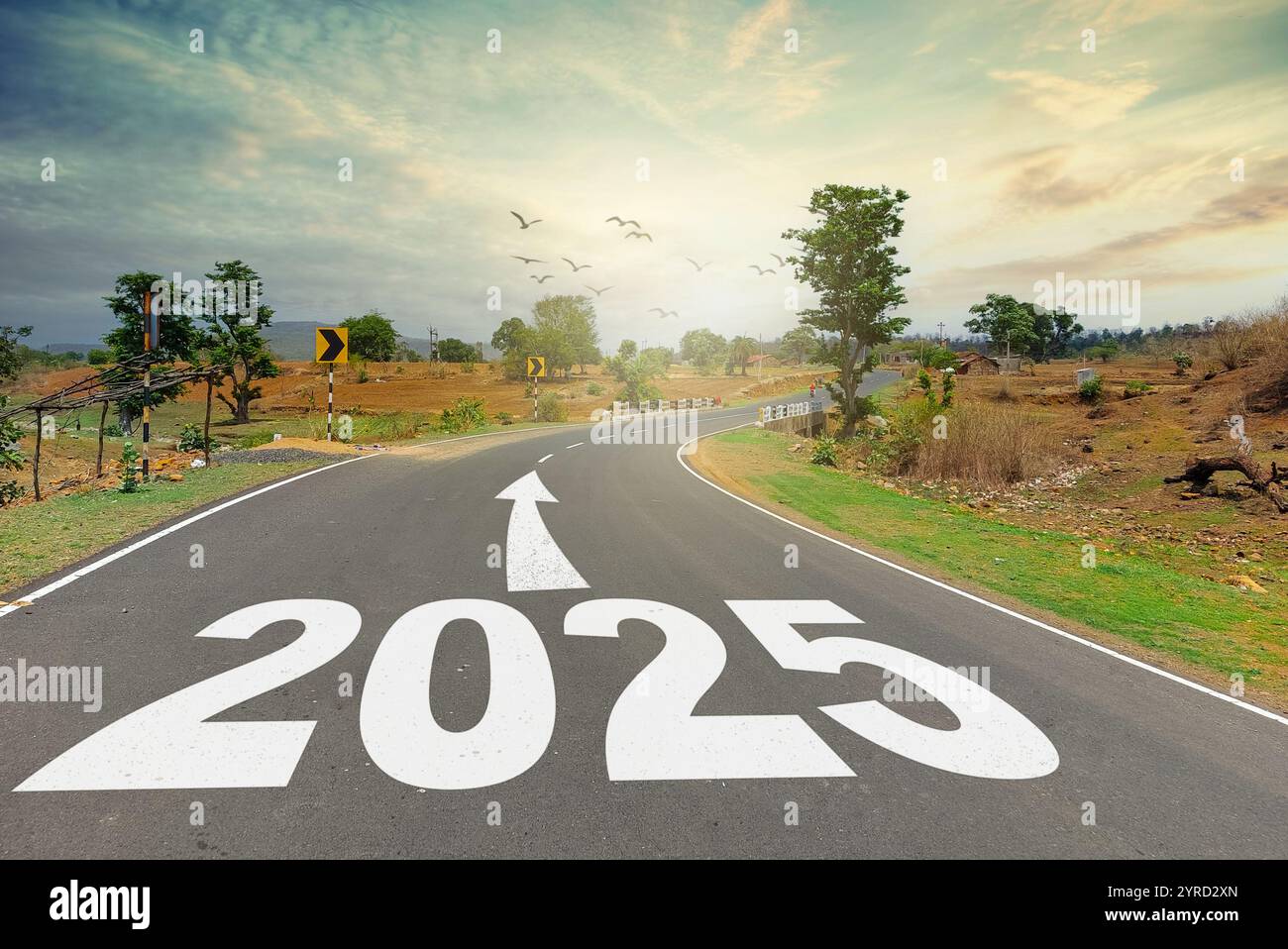 New year 2025 concept. Text 2025 written on the road in the middle of road at sunset. New Year