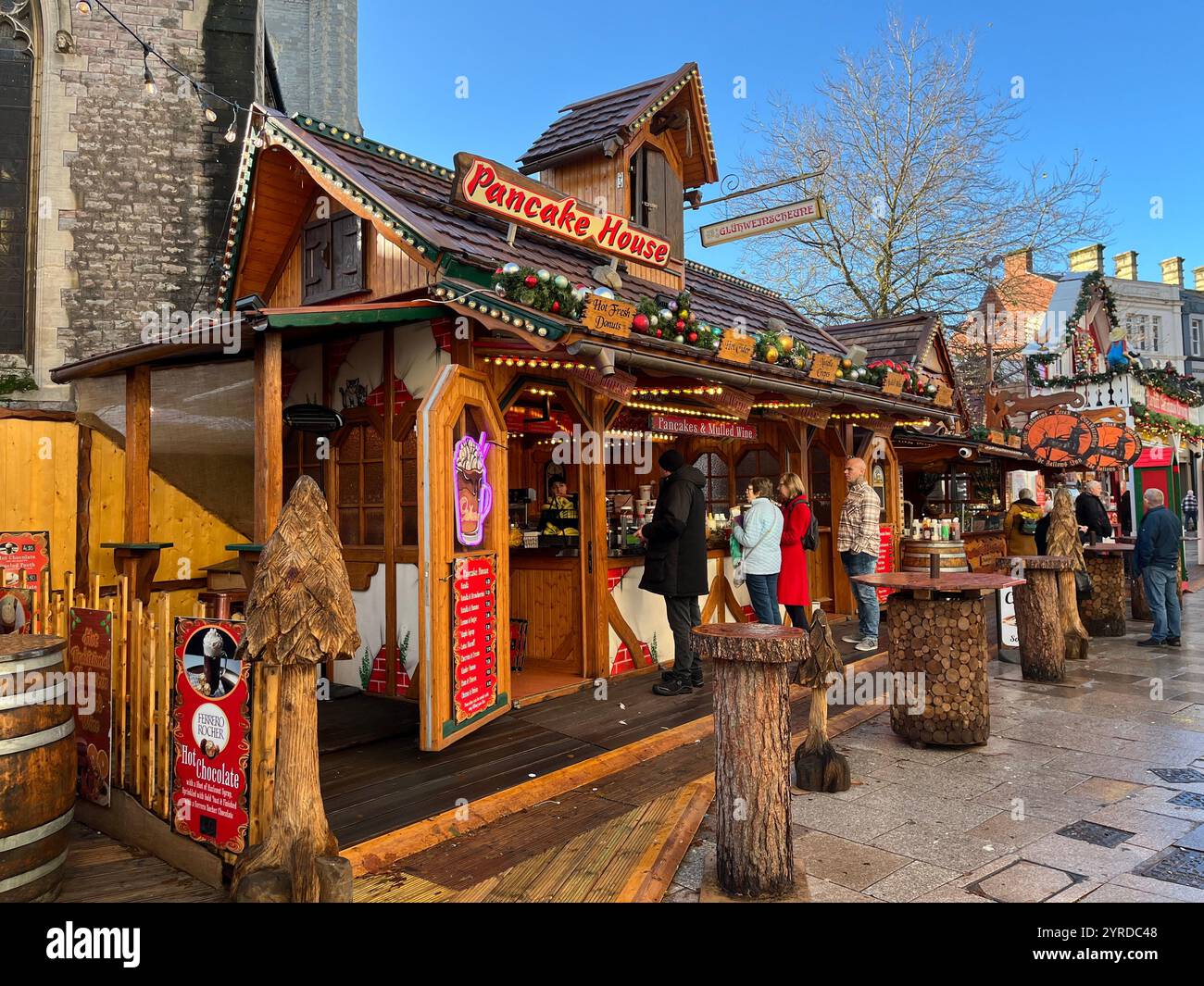 Pancake House at the German Style Christmas Market on Working Street next to St John's Church. Cardiff, Wales, United Kingdom. 26th November 2024. - Smartphone Captured Stock Image