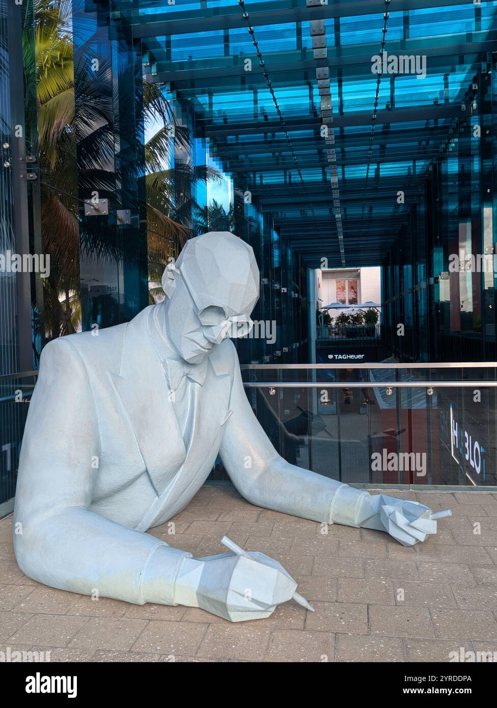 Large Scultpure of Man Writing in Miami Design District Stock Photo - Alamy