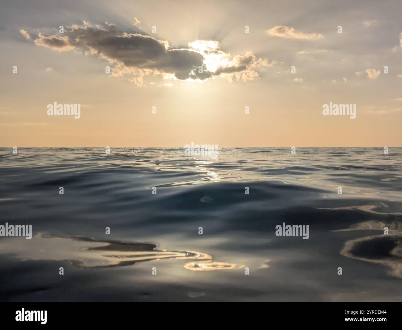 Smooth Waves and clouds at sunset - Smartphone Captured Stock Image
