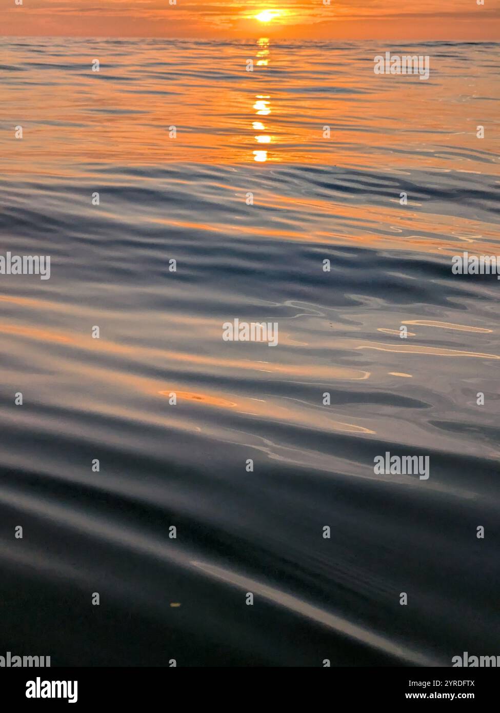 Smooth Waves and clouds at sunset - Smartphone Captured Stock Image