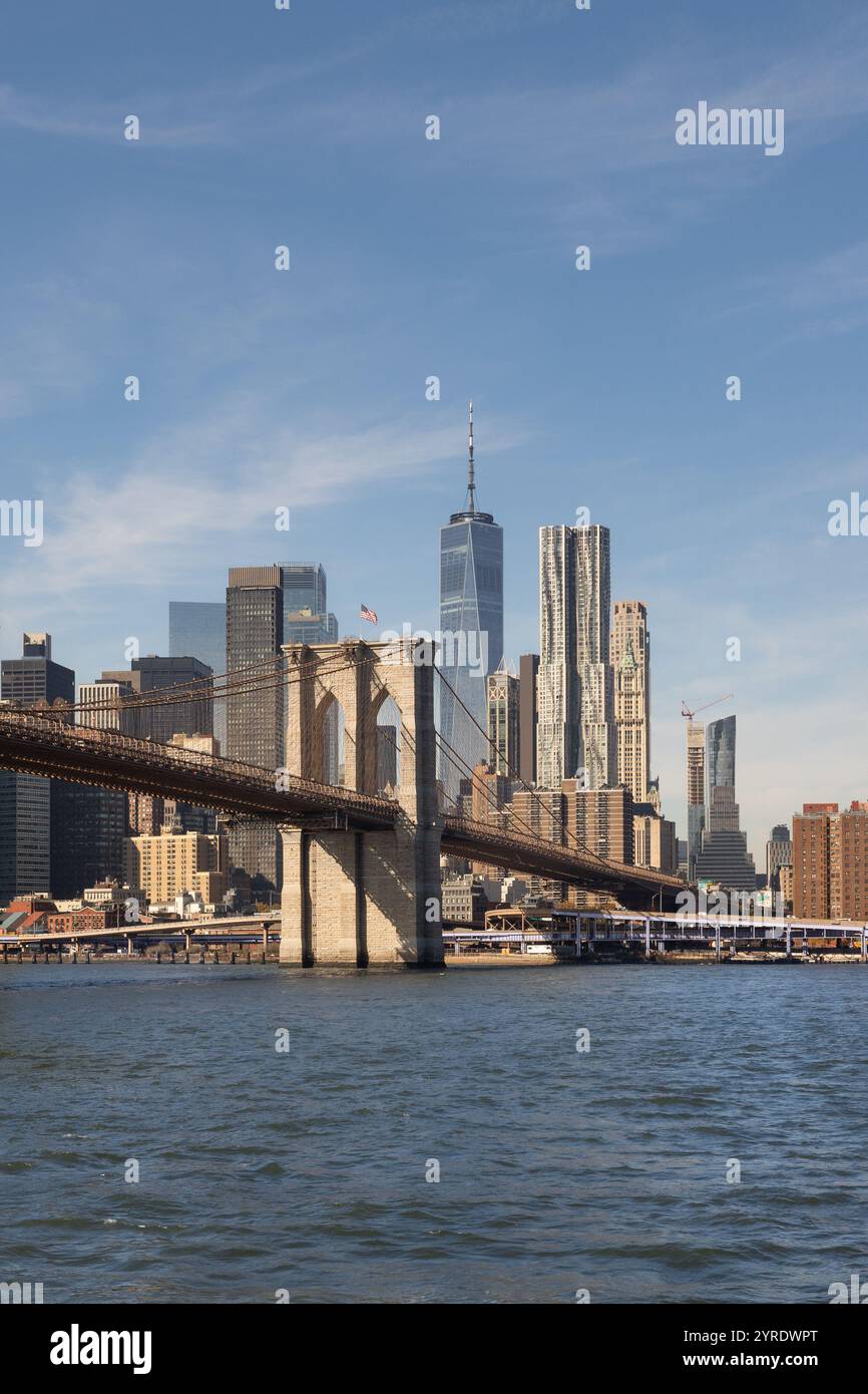 The Brooklyn Bridge stretches over the East River, linking Brooklyn to ...