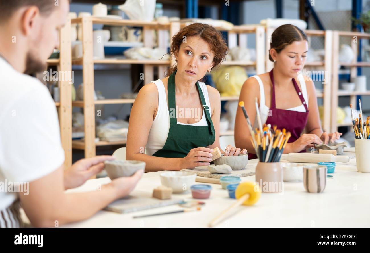 Three students in pottery hi-res stock photography and images - Alamy