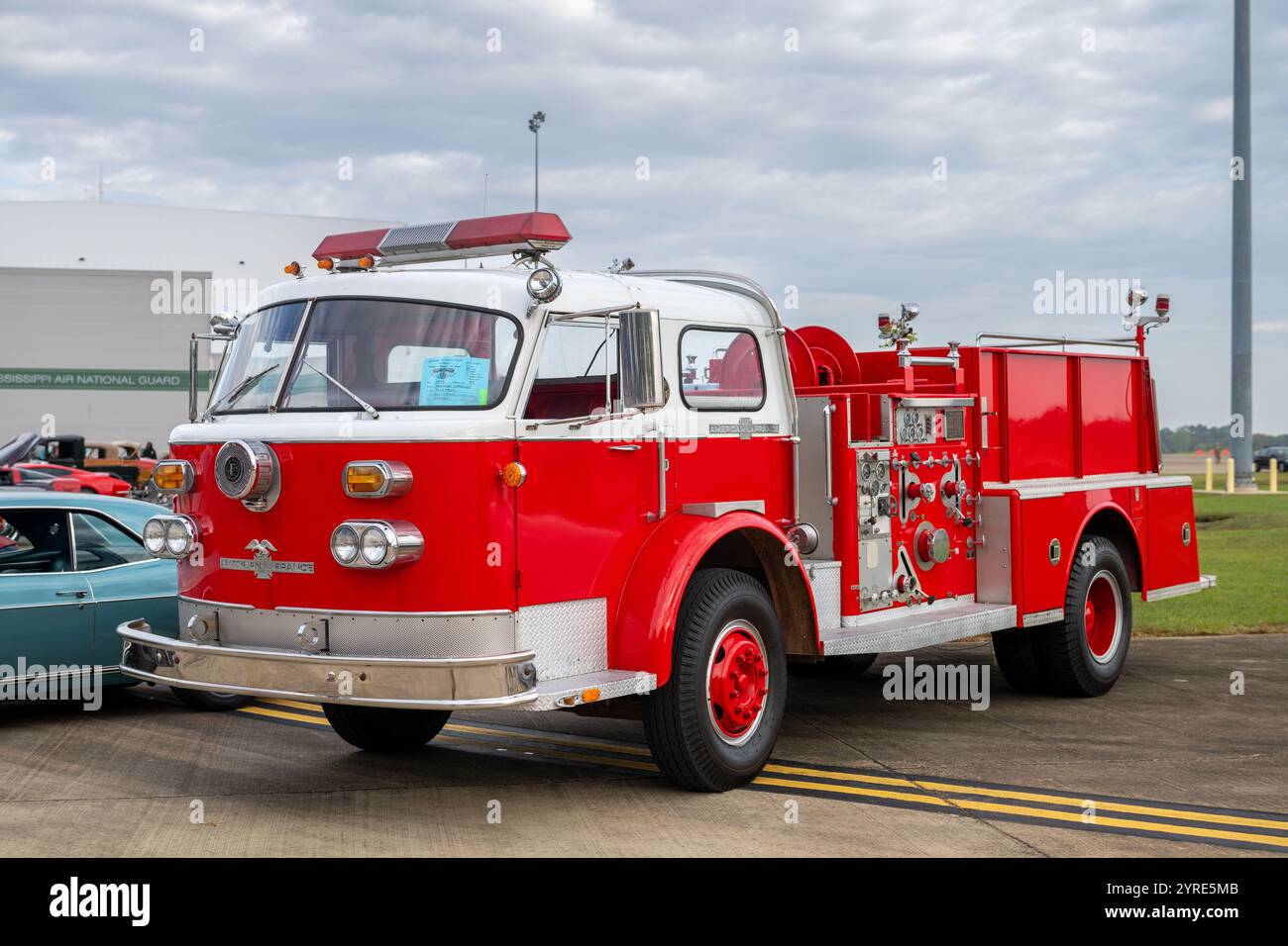 A red firetruck is parked on the flight line during Family Day on Nov. 2, 2024, at the 172nd Airlift Wing, Mississippi Air National Guard. Family Day is a base-wide event hosted annually by the 172nd AW where Airmen and their families can enjoy a variety of food and games, tour the base, and walk through a C-17 Globemaster III, among other things. (U.S. Air National Guard photo by Tech. Sgt. Vanessa Rivera) Stock Photo