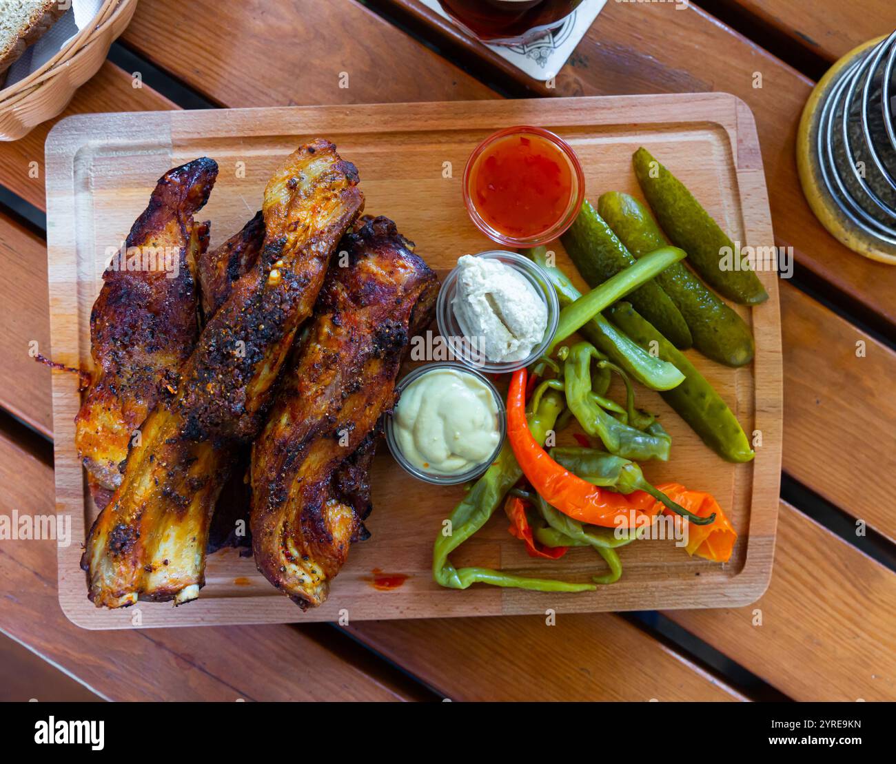 Baked pork ribs with pickled pepper, cucumbers, horseradish and mustard ...