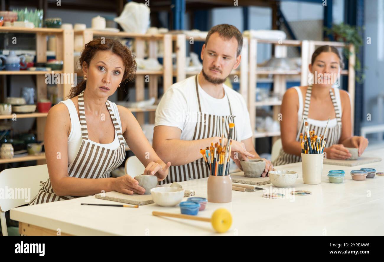 Three students in pottery hi-res stock photography and images - Alamy