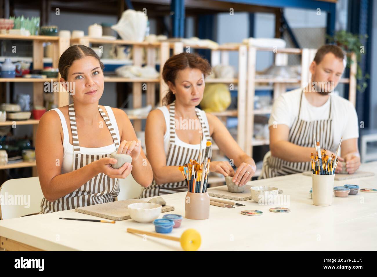 Three students in pottery hi-res stock photography and images - Alamy