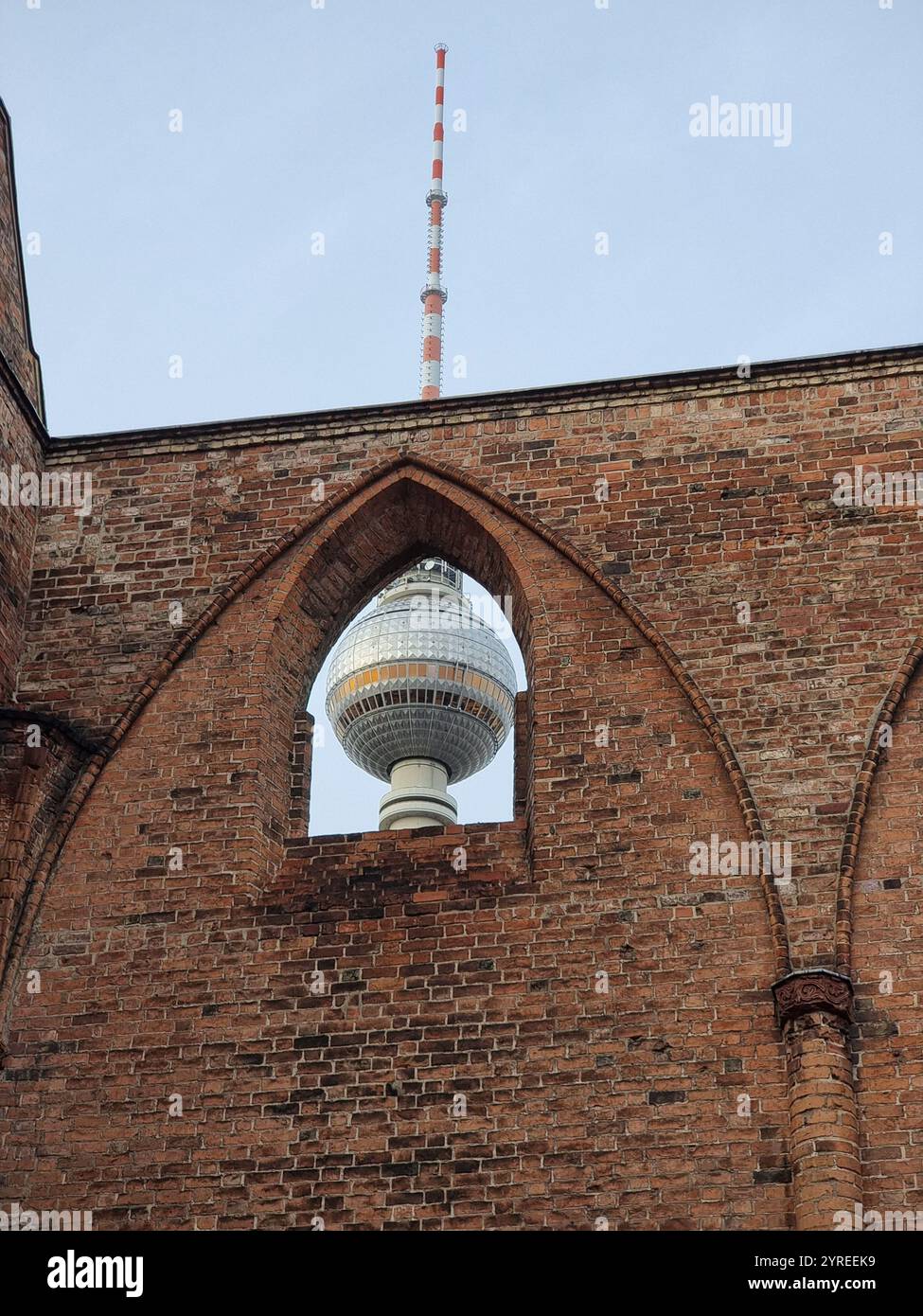 Berlin tower (Fersehturm) seen through arch in ruins of the Franciscan minster (monastery); remains of a medieval cloister culture in Berlin, Germany Stock Photo