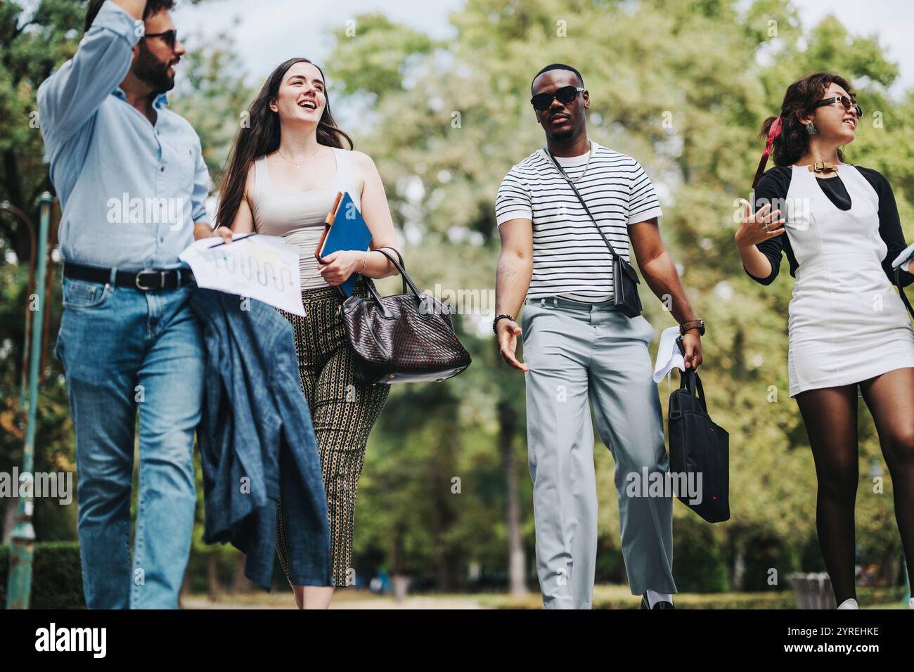 Group of business people enjoying a walk in the park Stock Photo - Alamy