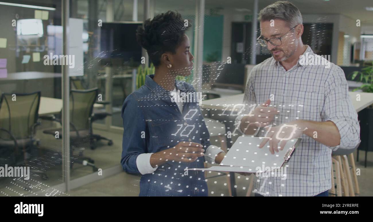 Image of binary coding over diverse colleagues discussing work Stock Photo