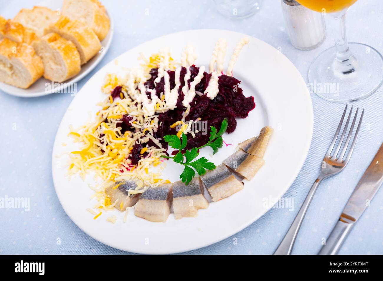 Beetroot served with cheese and pickled mackerel Stock Photo