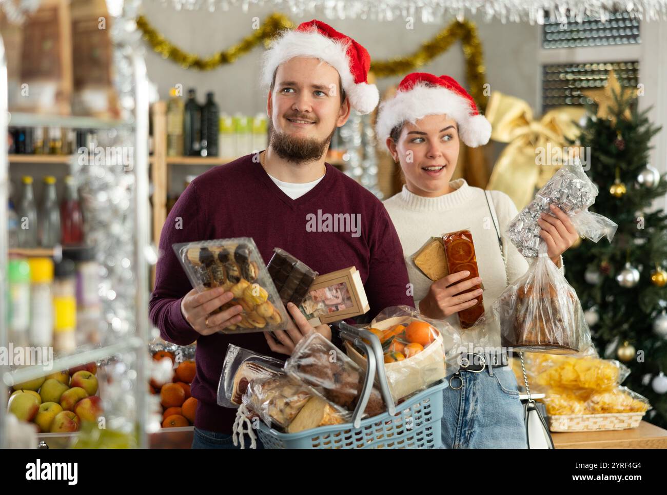 Preparing for Christmas celebration - happy family buys nougat ... Preparing for Christmas celebration - happy family buys nougat ...