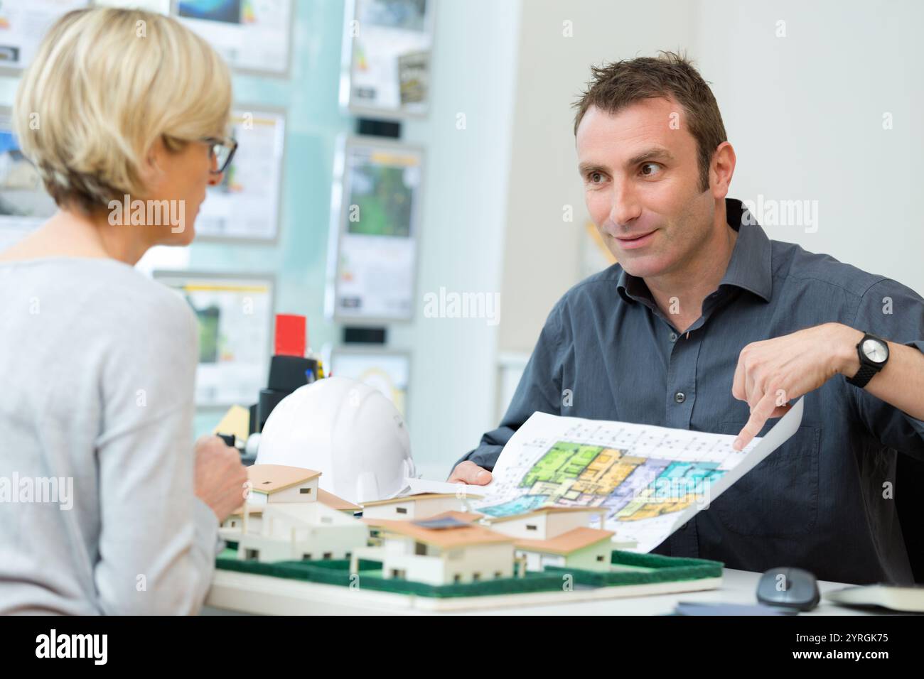 designers sitting at table and working on project Stock Photo