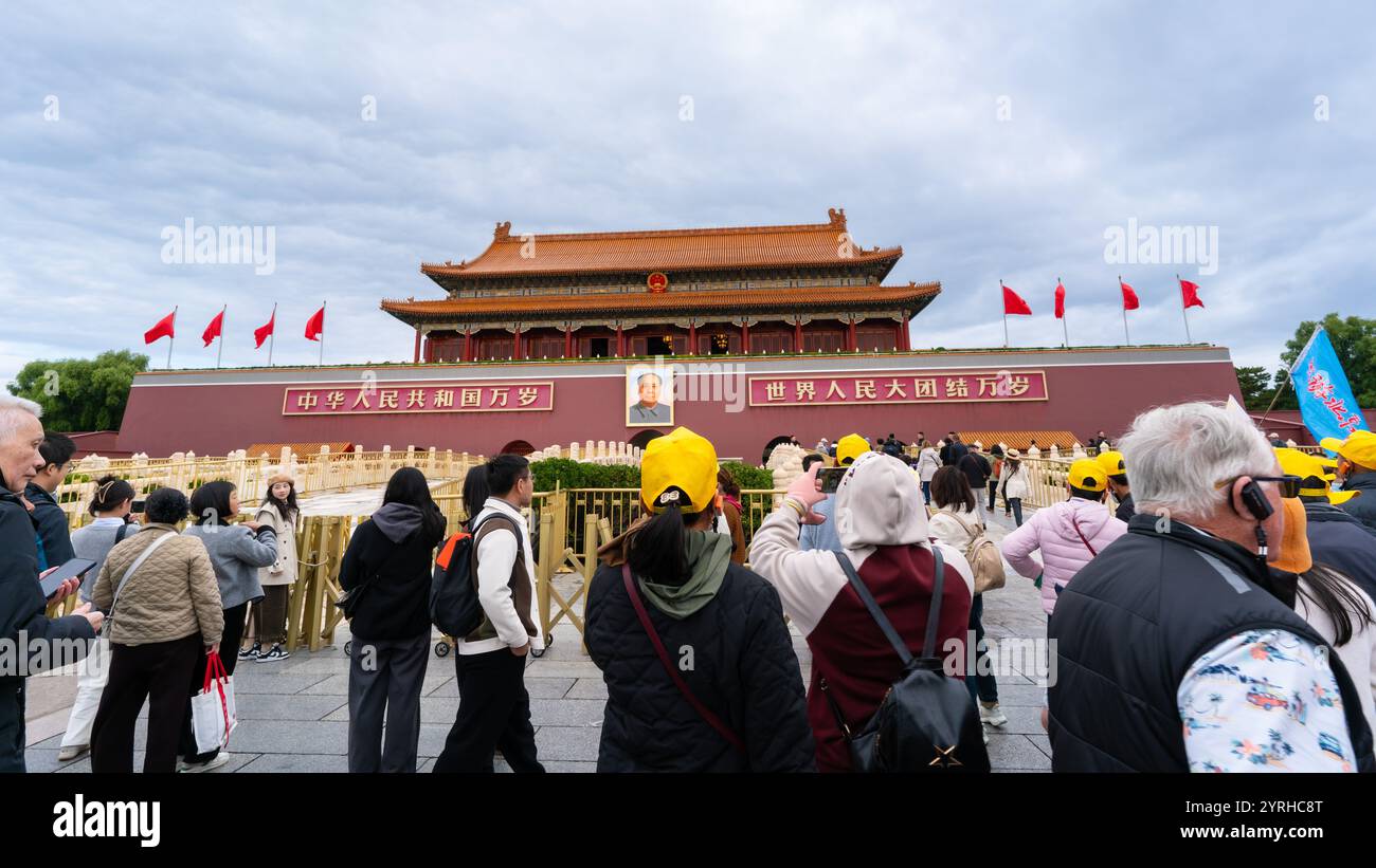 Beijing, China - Oct 22nd, 2024: Tourists in front of the entrance to the Forbidden City at Tiananmen Square in Beijing, China. Stock Photo