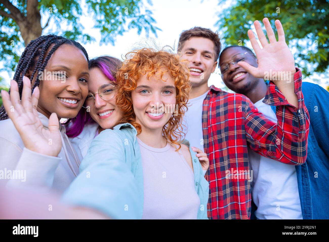 Diverse group people smiling waving hi-res stock photography and images ...