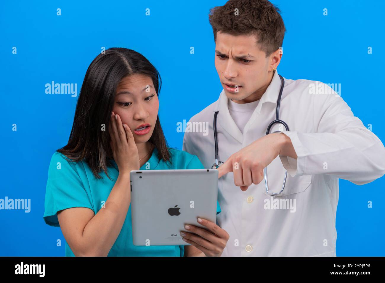 Healthcare professionals with patient hi-res stock photography and ...