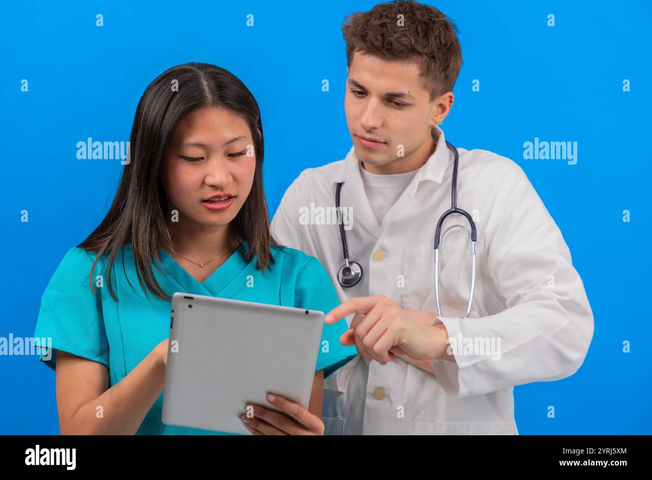 Reviewing patient data on tablet hi-res stock photography and images ...