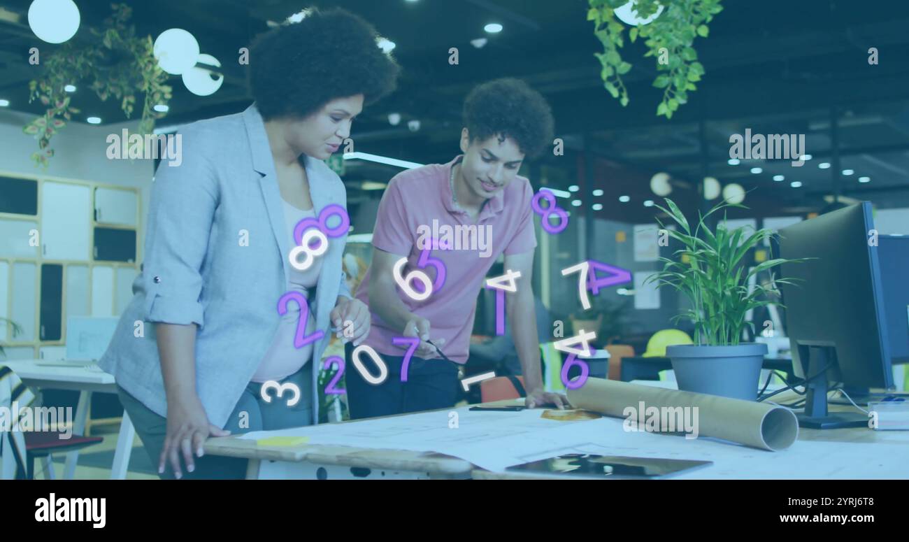Numbers image over two colleagues reviewing architectural plans in modern office Stock Photo