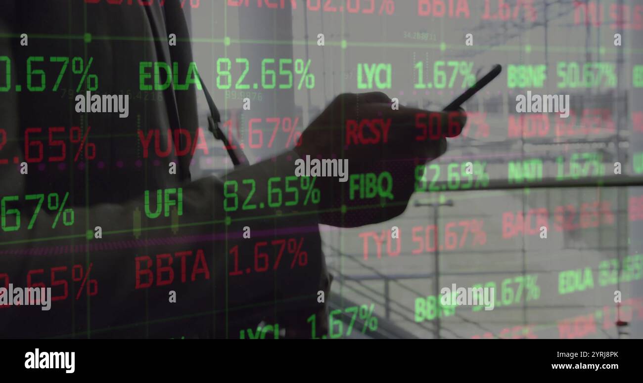 Image of young african american man analyzes stock market data on screens Stock Photo