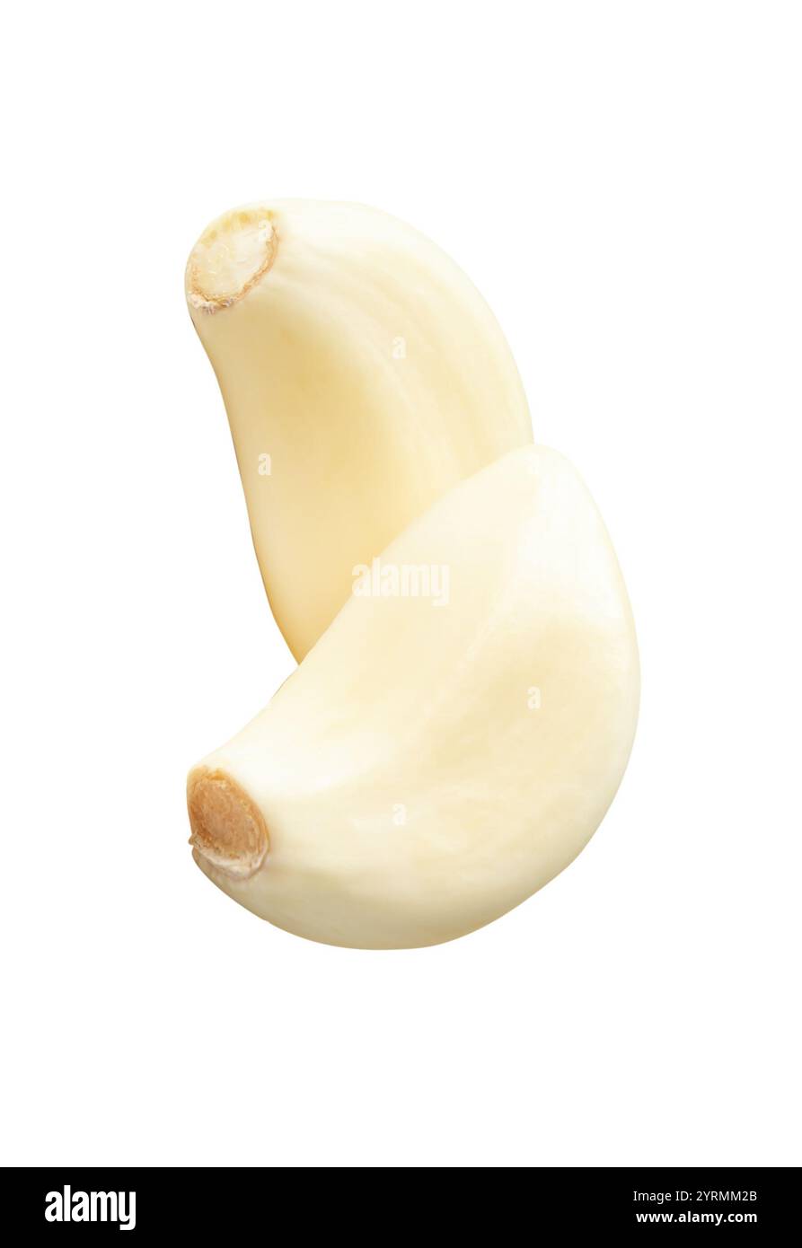 Top view of two peeled garlic cloves in stack is isolated on white ...