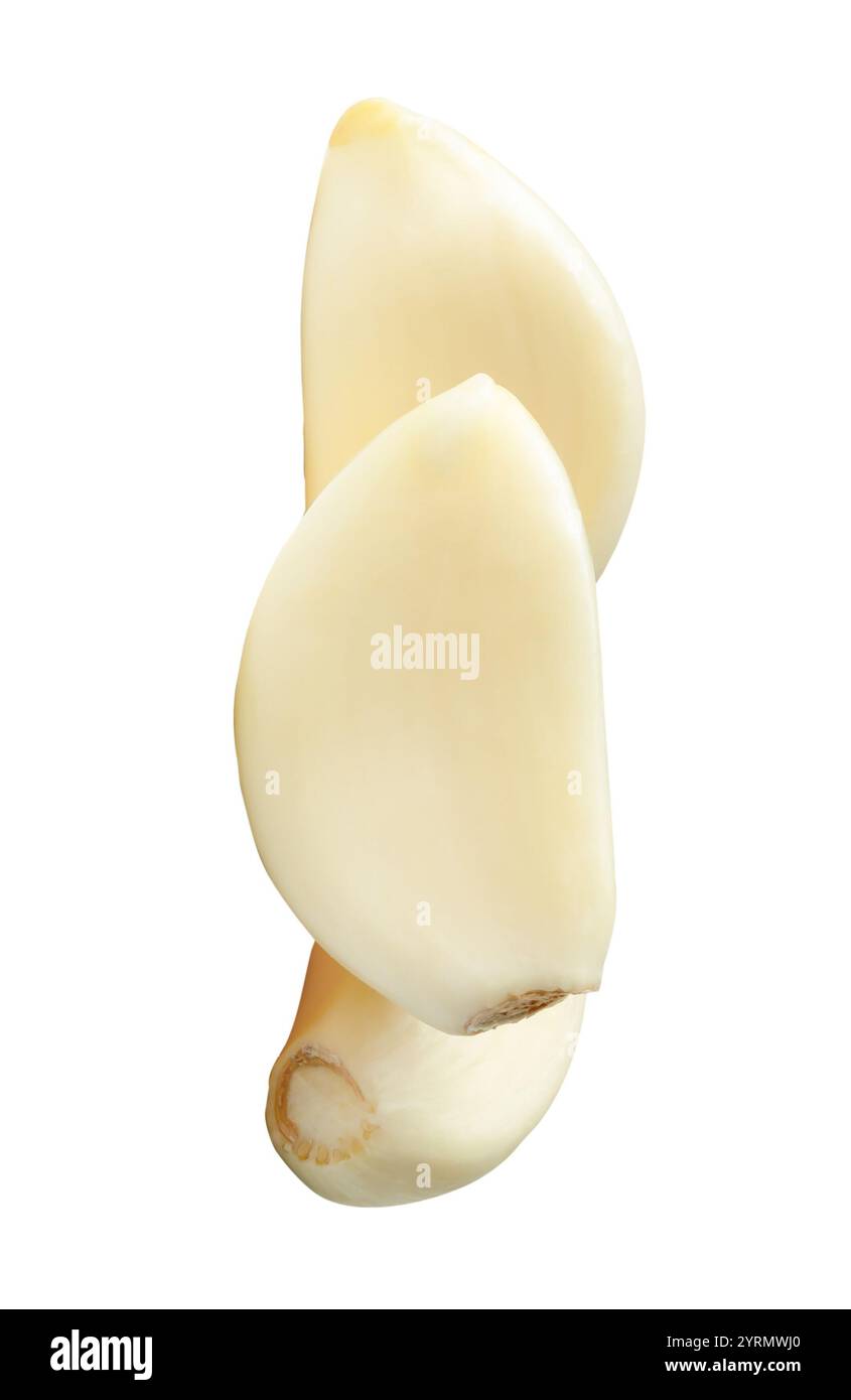 Top view of three peeled garlic cloves in stack is isolated on white ...