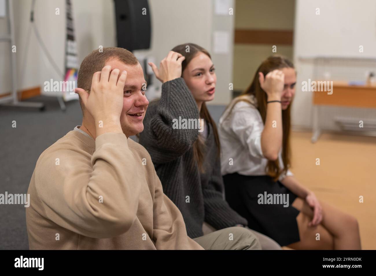 Hearing impaired students communicate during breaks at the university ...