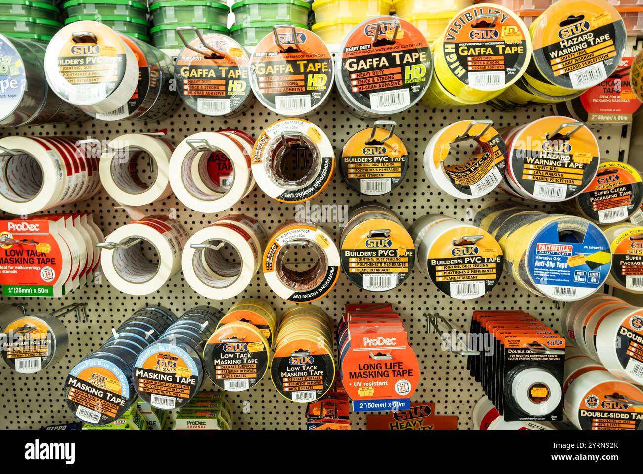 rolls of different brands of tape masking tapes on sale on display in an independent DIY trade centre shop store in Cornwall in the UK. Stock Photo