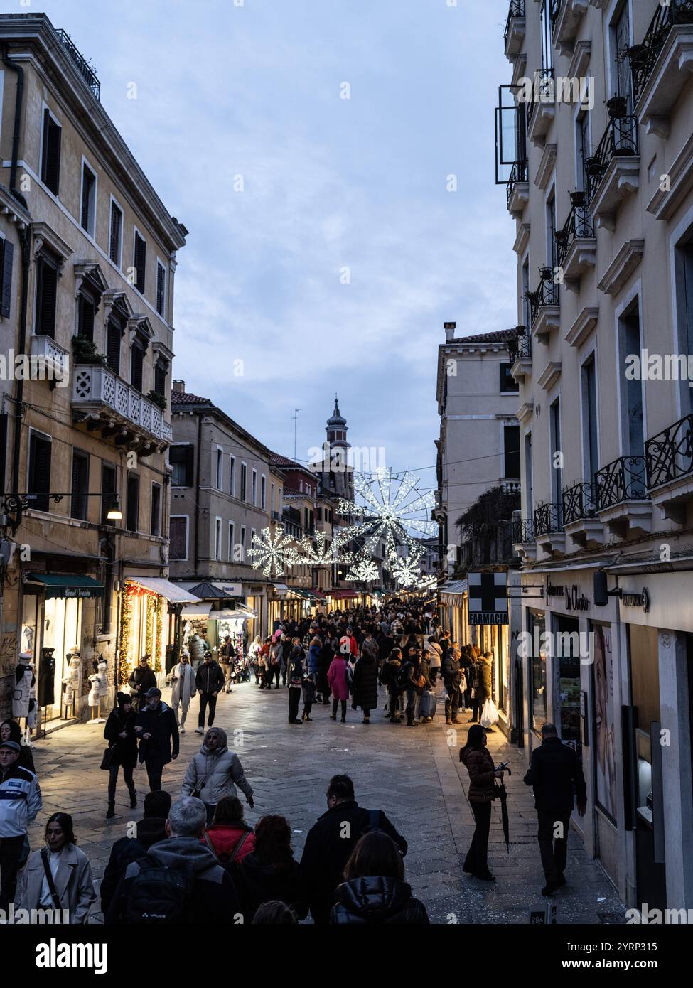 NIght streets of Venice, Italy in winter during the carnival season. Stock Photo
