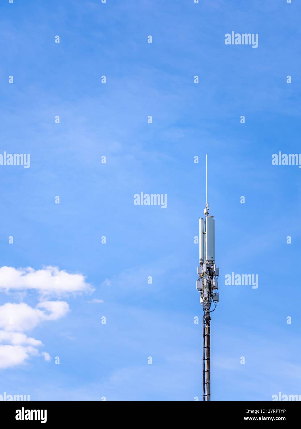 mobile phone antenna tower agains blue sky background. 5G. 4G, 3G mobile technologies Stock Photo