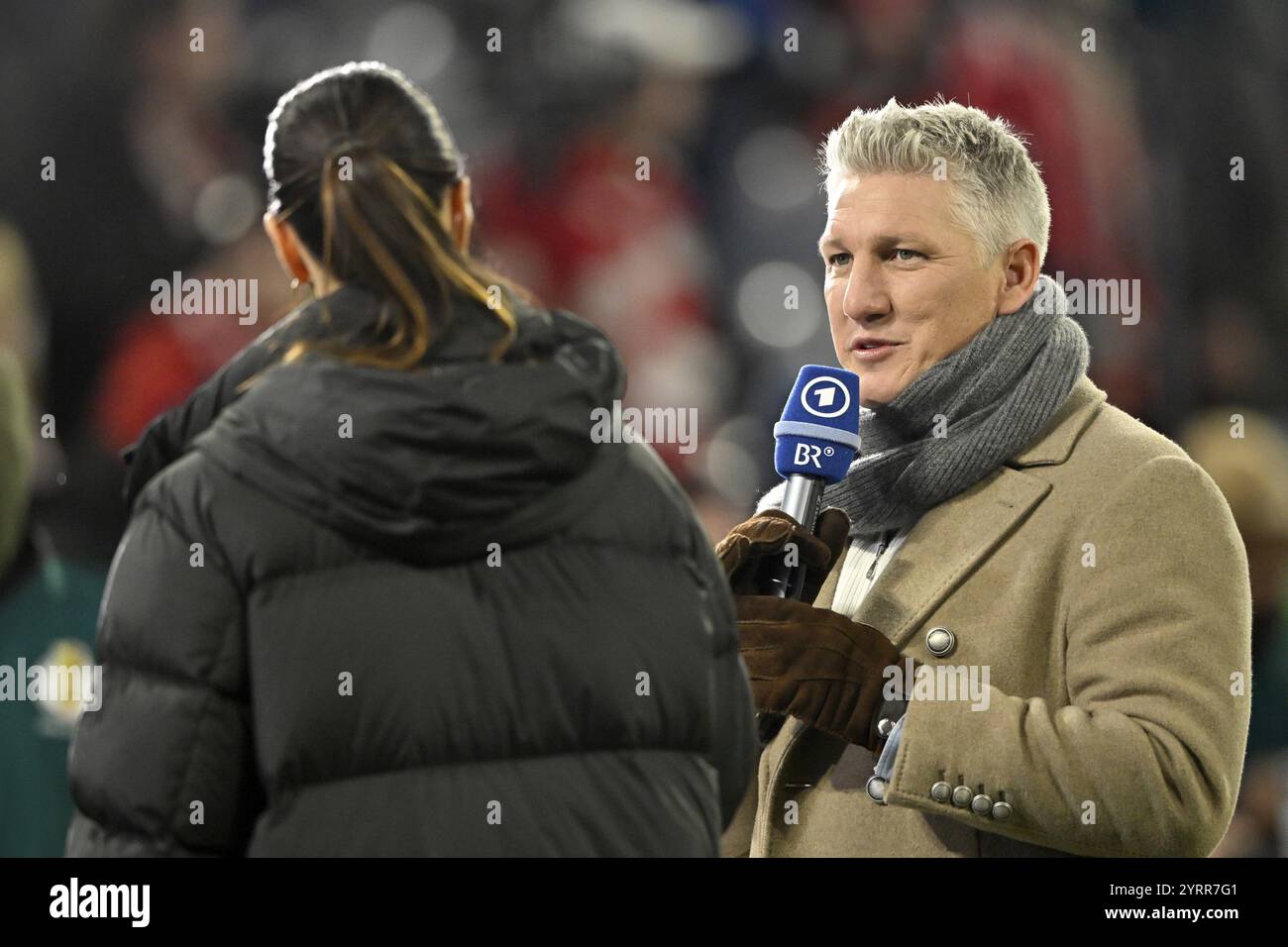 ARD presenter and reporter Esther Sedlaczek in an interview Microphone, microphone, logo, with TV pundit Bastian Schweinsteiger, DFB Cup round of 16, Stock Photo
