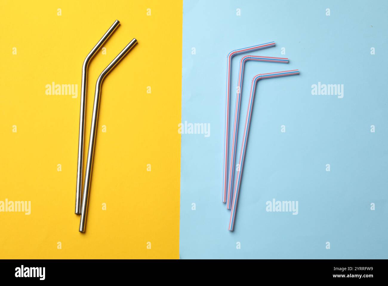 Different drinking straws on color background, flat lay Stock Photo