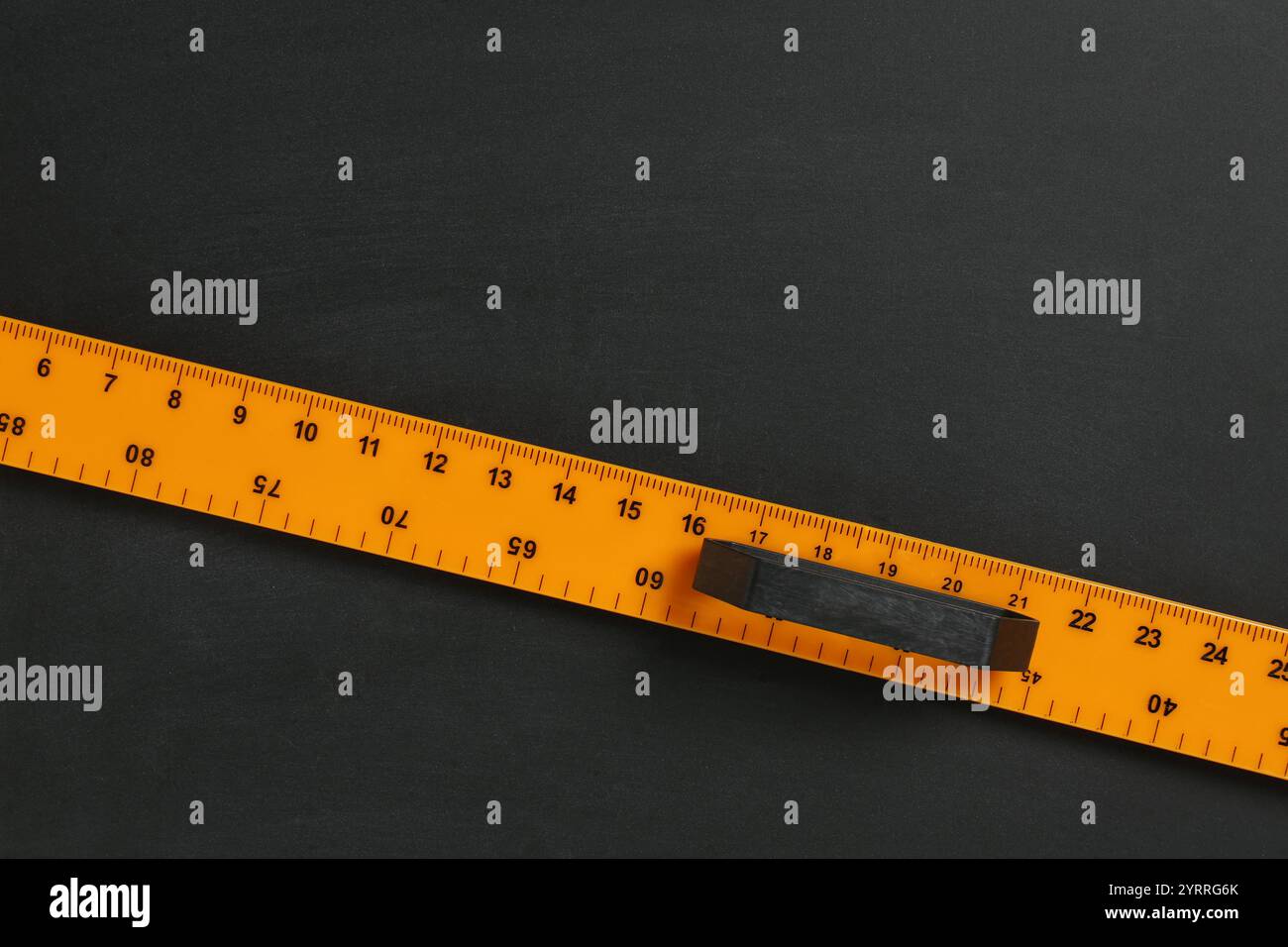 One ruler on black chalkboard, top view. Space for text Stock Photo - Alamy