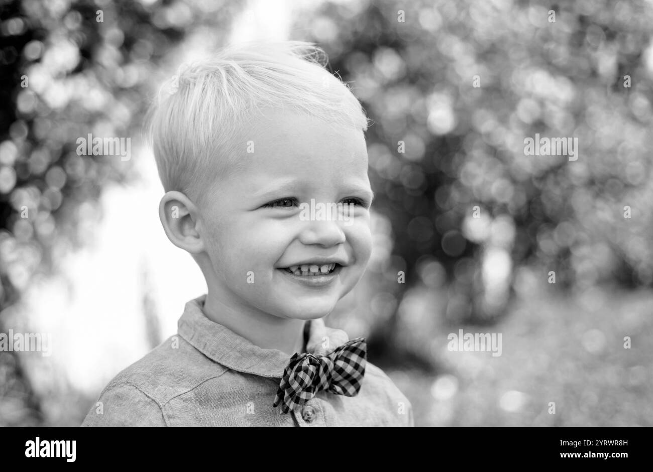 Spring smiling child. Sunny portrait of little boy. Happy childhood ...