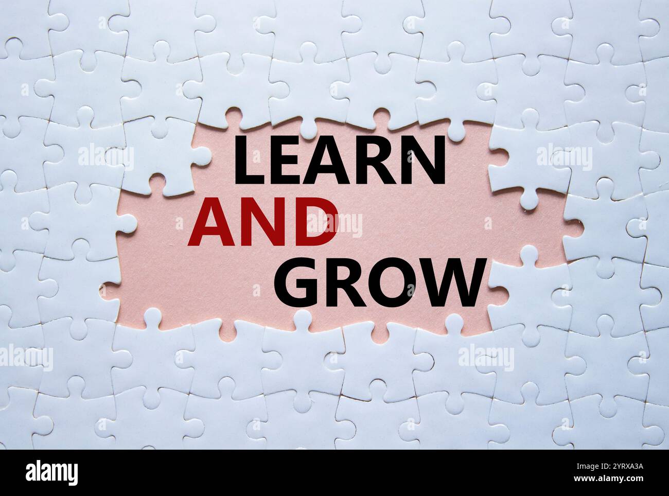 Learn and grow symbol. Concept words Learn and grow on white puzzle ...