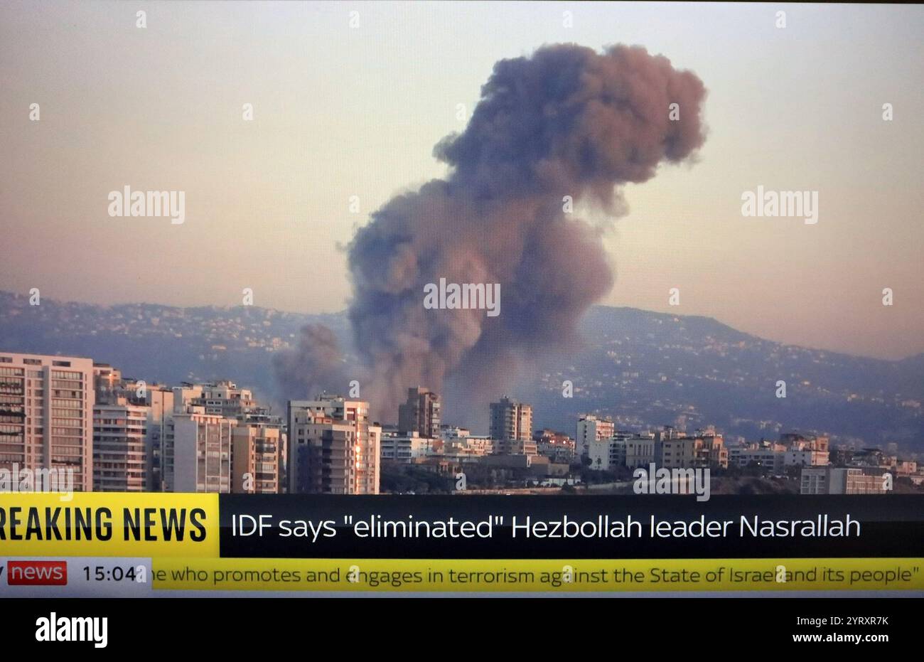 Television news media coverage of the Israeli attack which led to the death of Hassan Nasrallah (1960 ? 27 September 2024); Lebanese cleric and politician who served as the secretary general of Hezbollah, a Shia Islamist political party and militia, from 1992 until his assassination in 2024. Stock Photo