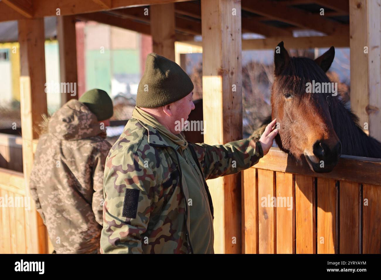 Non Exclusive: KOSIV, UKRAINE - DECEMBER 2, 2024 - Servicemen pet ...
