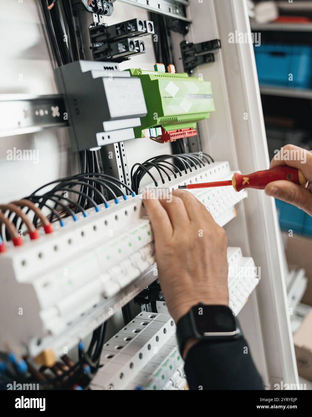 A close-up shot of a wire connected in a smart home electrical box. The image showcases intricate wiring details, neatly organized within the box Stock Photo