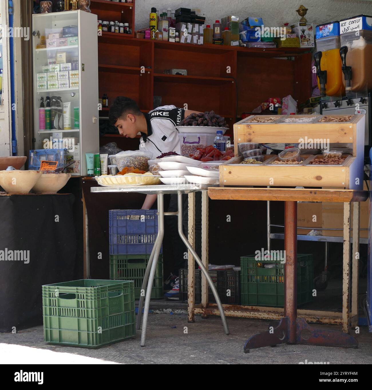 Arab boy selling fruit drinks, in The Muslim Quarter (Harat al-Muslimin), Old city of Jerusalem. It is the largest and most populous of the four quarters and is situated in the north-eastern corner of the Old City Stock Photo