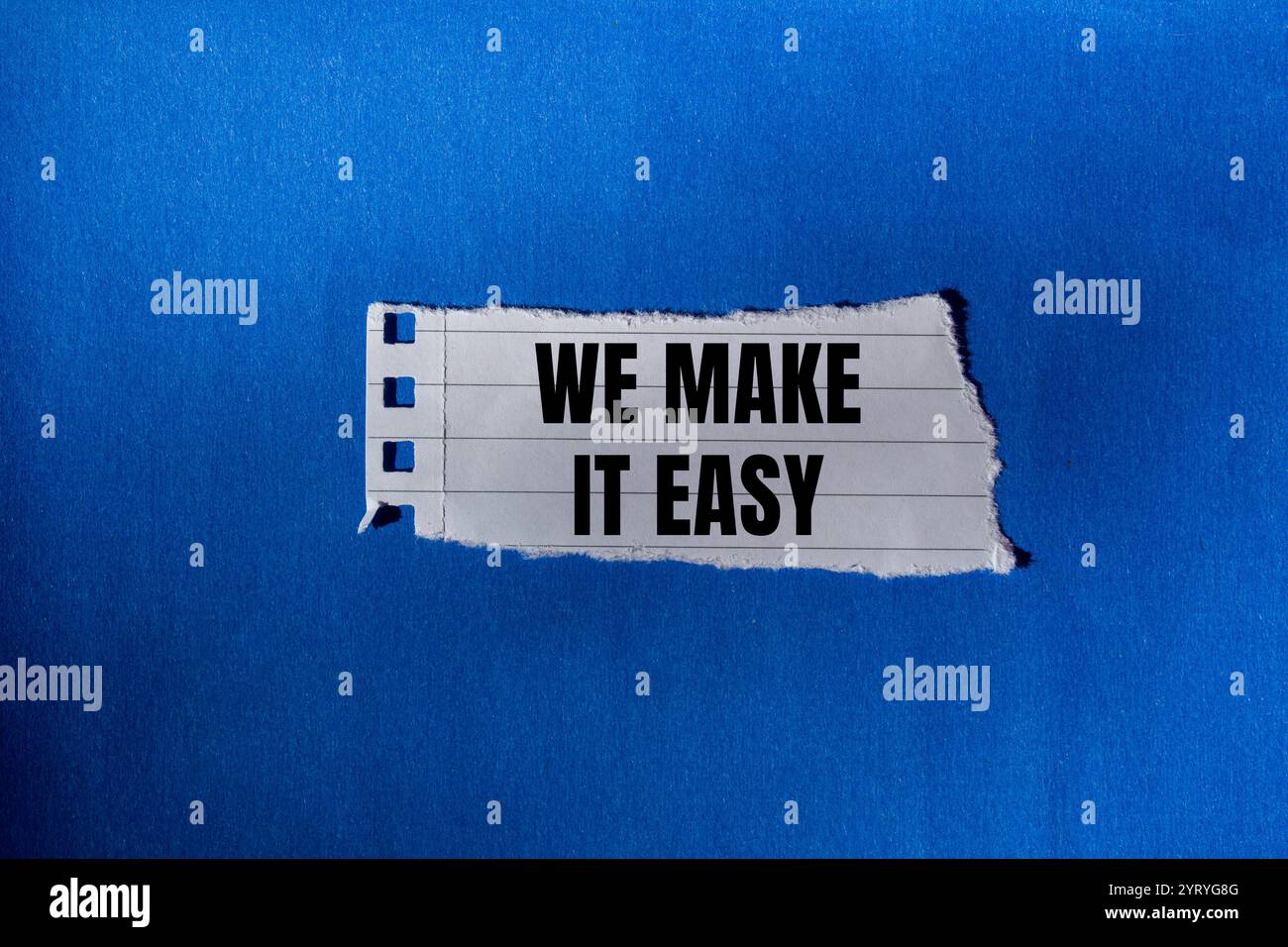 We make it easy message written on ripped torn paper piece with blue ...