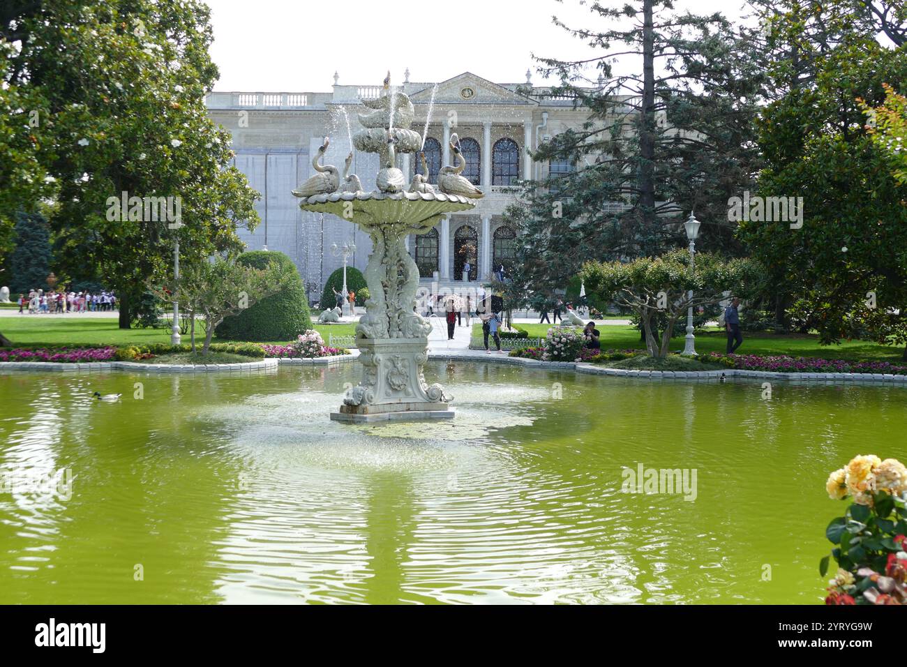 Fountain in the garden, Dolmabahce Palace, Istanbul, Turkey, on the European coast of the Bosphorus, served as the main administrative center of the Ottoman Empire from 1856 - 1887 and 1909 - 1922. Dolmabahce Palace was ordered by the Empire's 31st Sultan, Abdulmecid I, and built between the years 1843 and 1856. The design contains eclectic elements from the Baroque, Rococo and Neoclassical styles, blended with traditional Ottoman architectureDecor and equipment Stock Photo