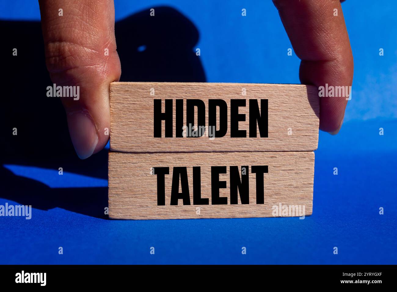 Hidden talent message written on wooden blocks with blue background