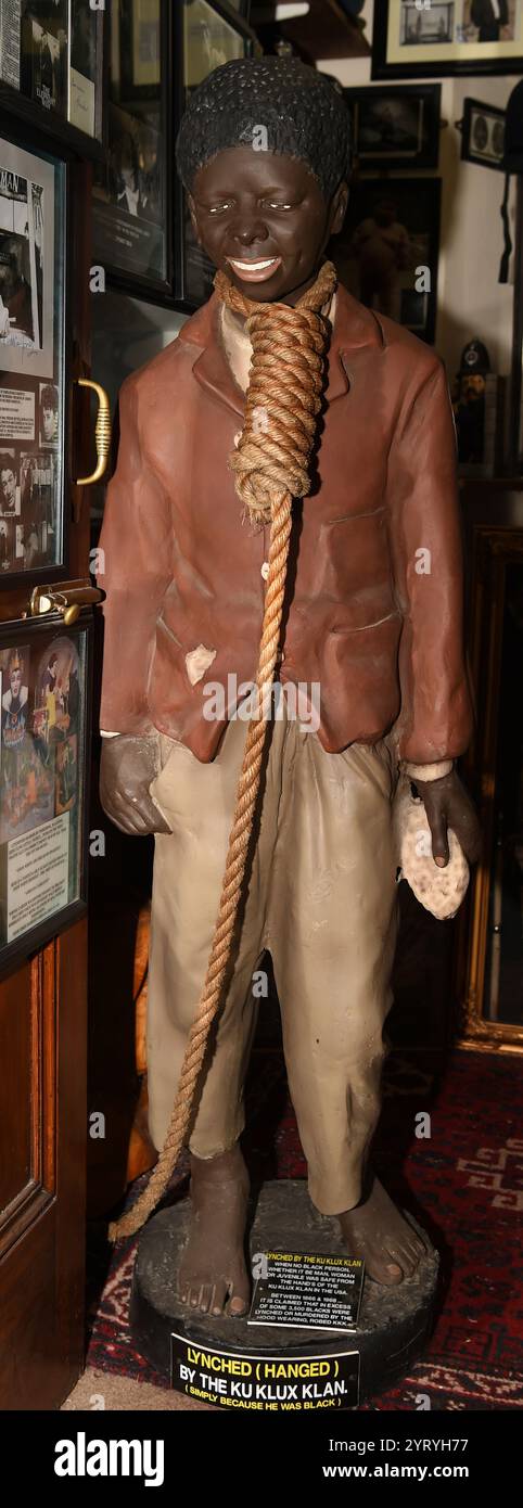 American statuette circa 1909 depicting a an African American boy, with a lynching rope around his neck. This racist stereotype of African Americans, reinforced the arbitrary extra-judicial use of lynching as a weapon of fear to supress African Americans in certain parts of the USA up to the 1930's. Stock Photo