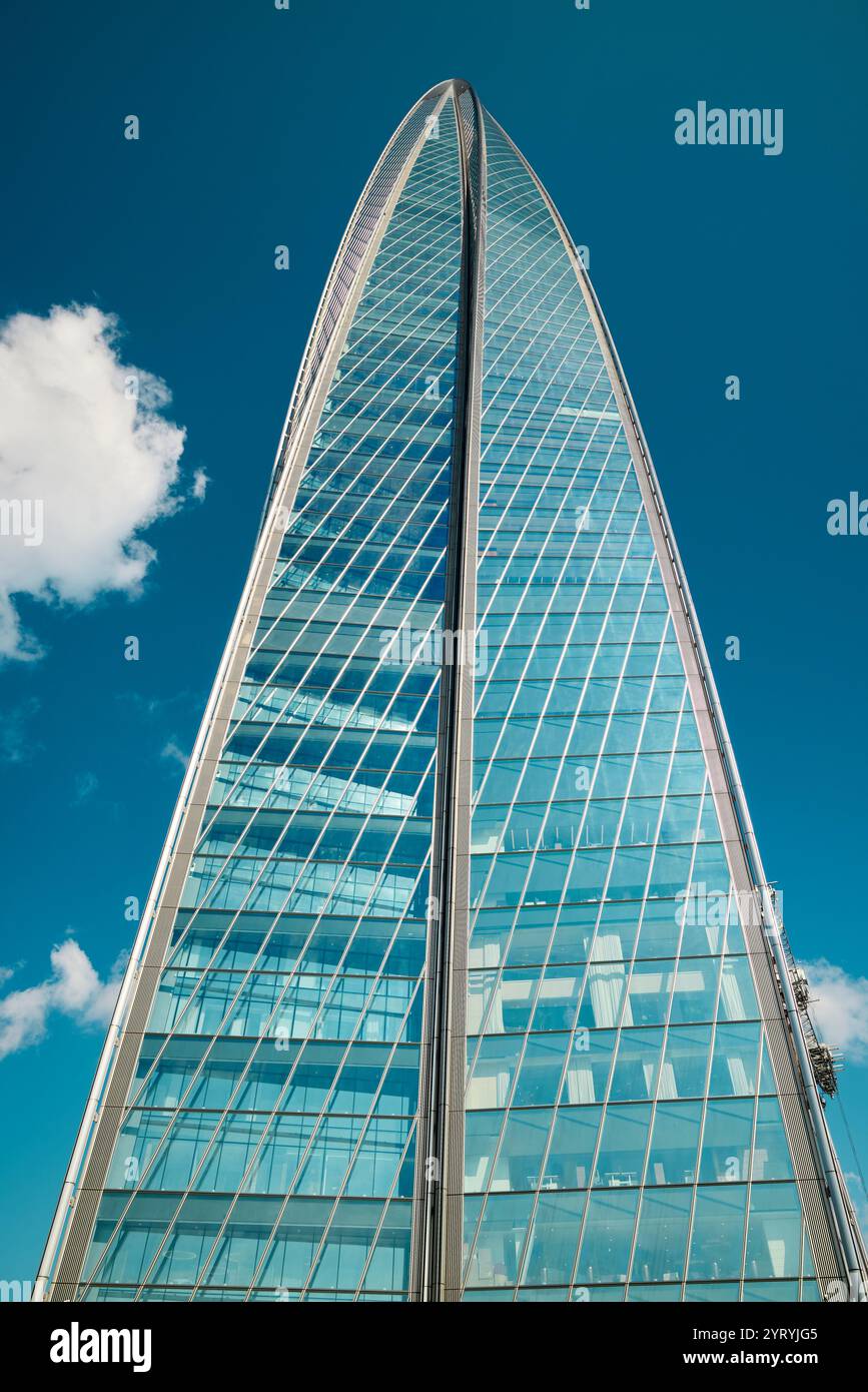 A stunningly designed glass tower rises elegantly and gracefully ...