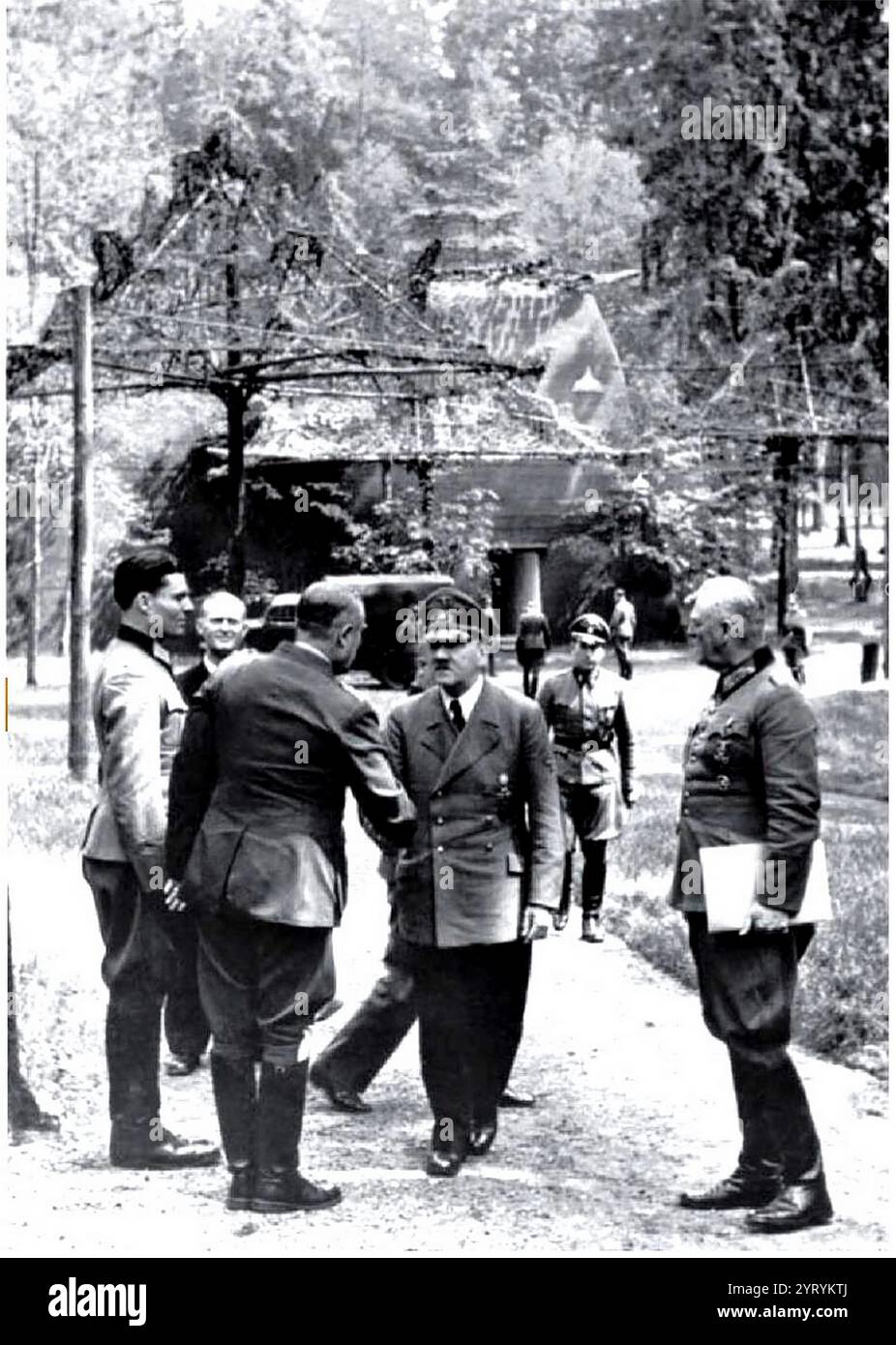 Hitler at the Wolf's Lair Headquarters, one week before the July 20th assassination attempt. Graf von Stauffenberg is shown at the left with Hitler (centre) and General Keitel (right). Stock Photo