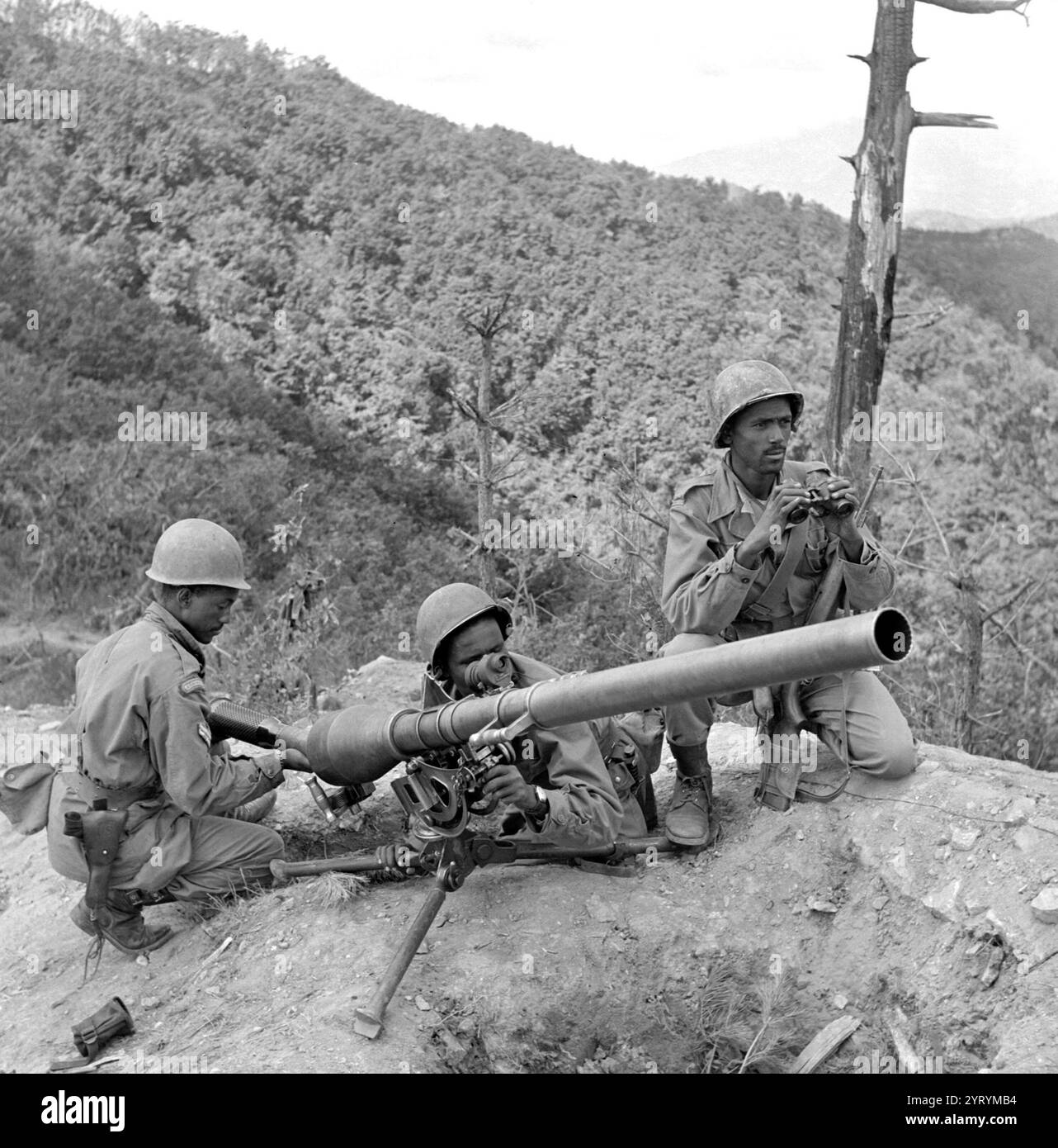 The Kagnew Battalions were military units from the Ethiopian Army which fought as part of United Nations Command in the Korean War (1950?53). Ethiopia was the first nation in Africa to contribute a complete unit of ground troops to the UN Korean command. Three Ethiopian gunners from Addis Ababa preparing to fire a 75mm recoil-less rifle are, from left to right: Corporal Alema Welde, Corporal Chanllo Bala and Sergeant Major Bogale Weldeynse Stock Photo